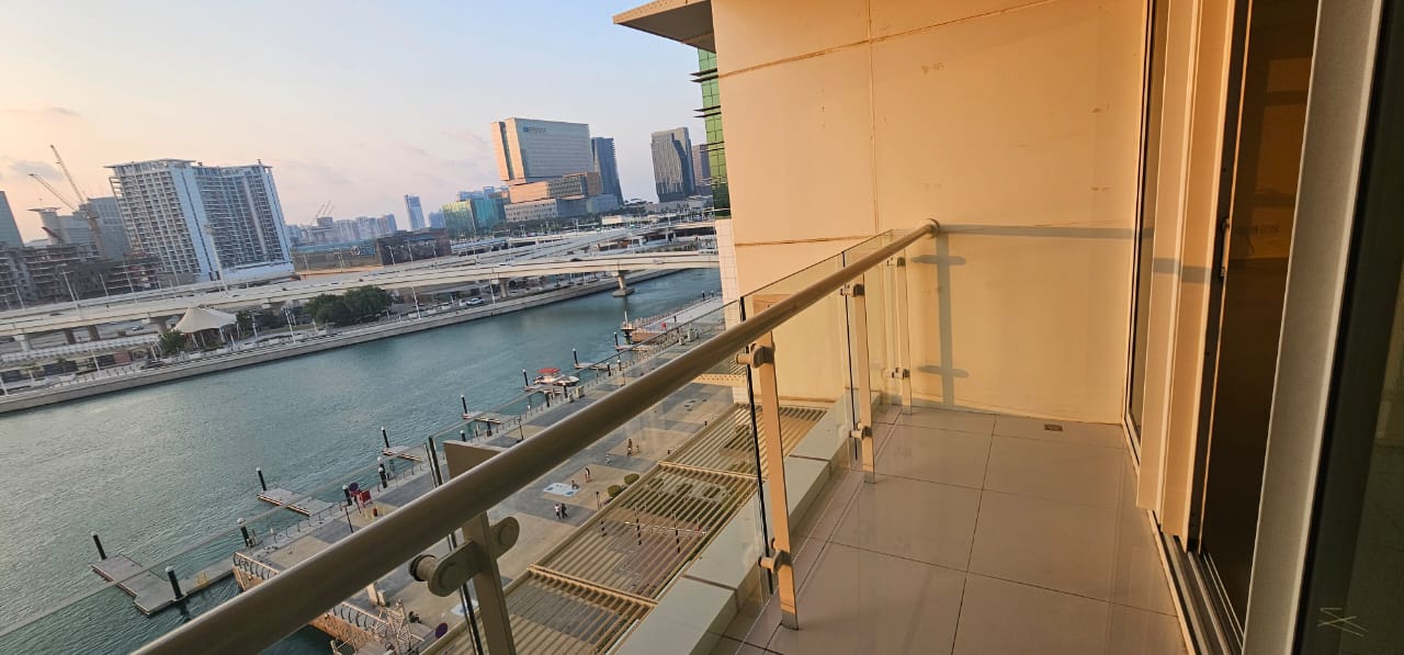 Sunset canal view from the balcony of a 3 bedroom apartment in Tala Tower, Al Reem Island