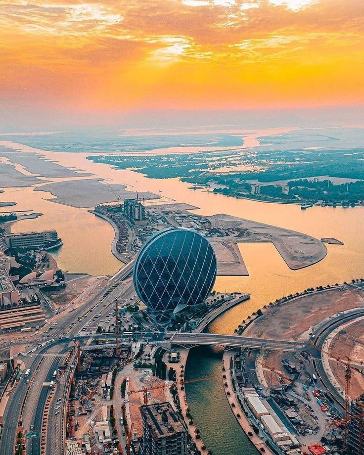 Aerial view of Al Raha at sunset with Aldar HQ, Abu Dhabi