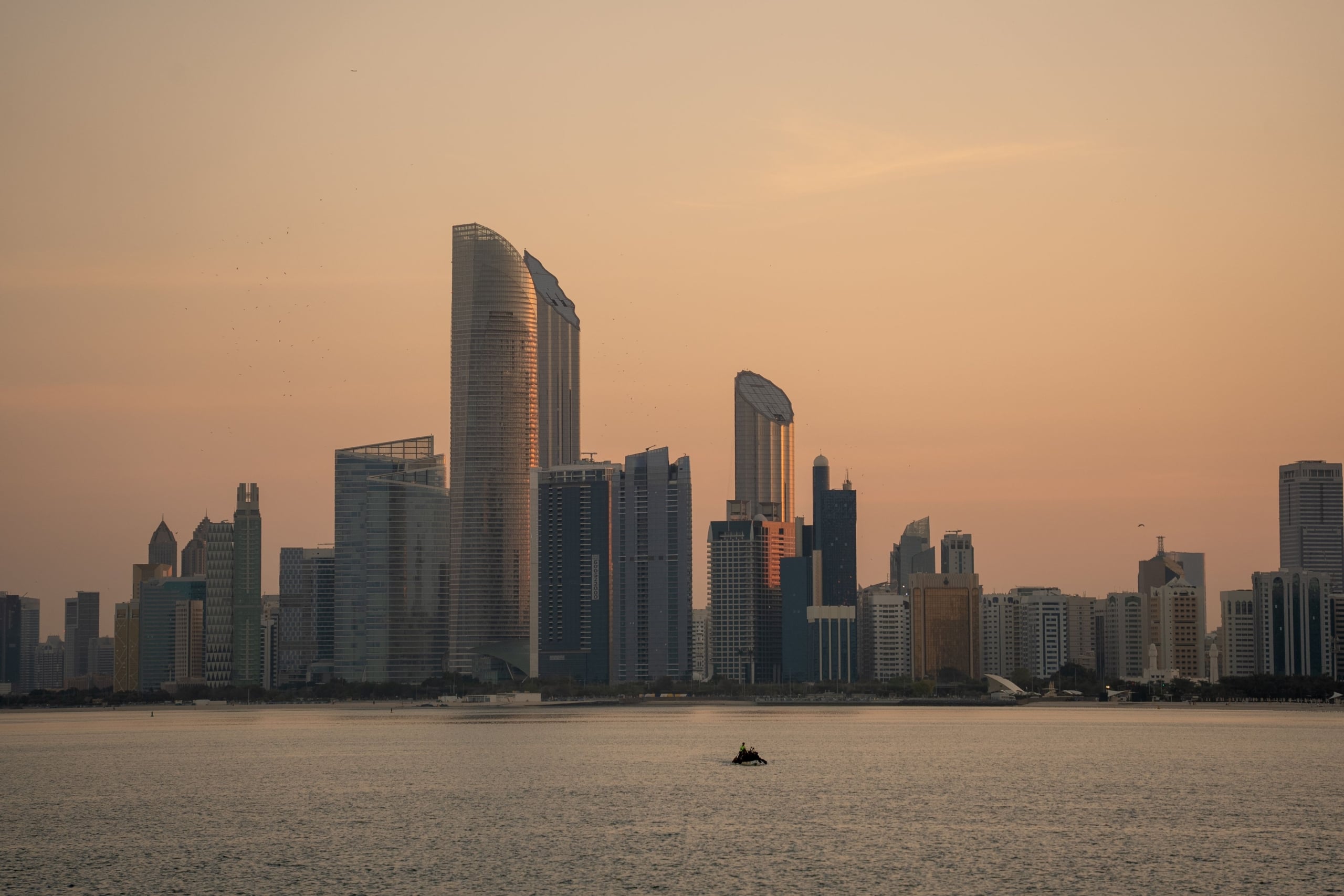 Abu Dhabi waterfront skyline and modern towers in warm evening light