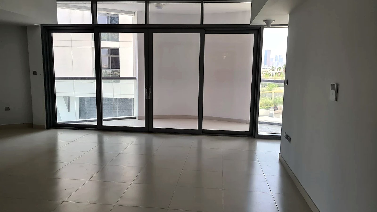 Living room with sliding doors to the balcony, Shams Meera, Al Reem Island