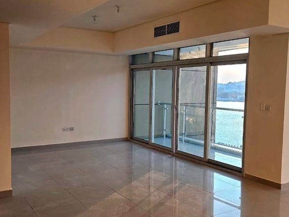 Living room with balcony access and water view, Tala Tower, Marina Square