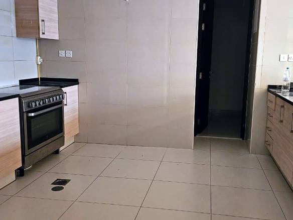 Semi open kitchen with built in cooker, Tala Tower apartment, Al Reem Island