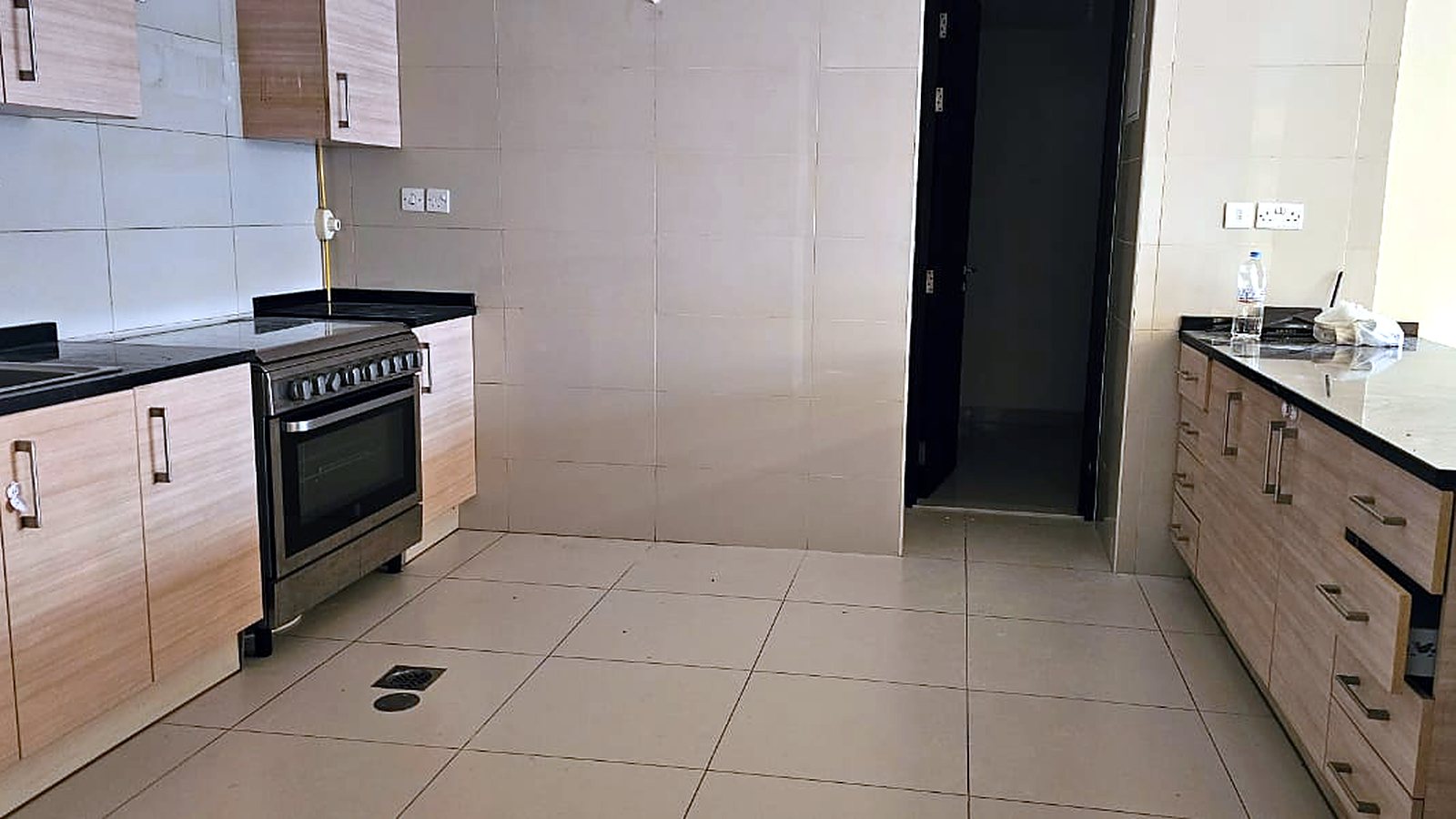 Semi open kitchen with built in cooker, Tala Tower apartment, Al Reem Island